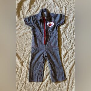 Vintage toddler pinstripe jumpsuit with red zipper and race car detail.